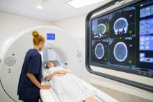 CT Technologist Scanning Female Patient in Hospital - MTMI